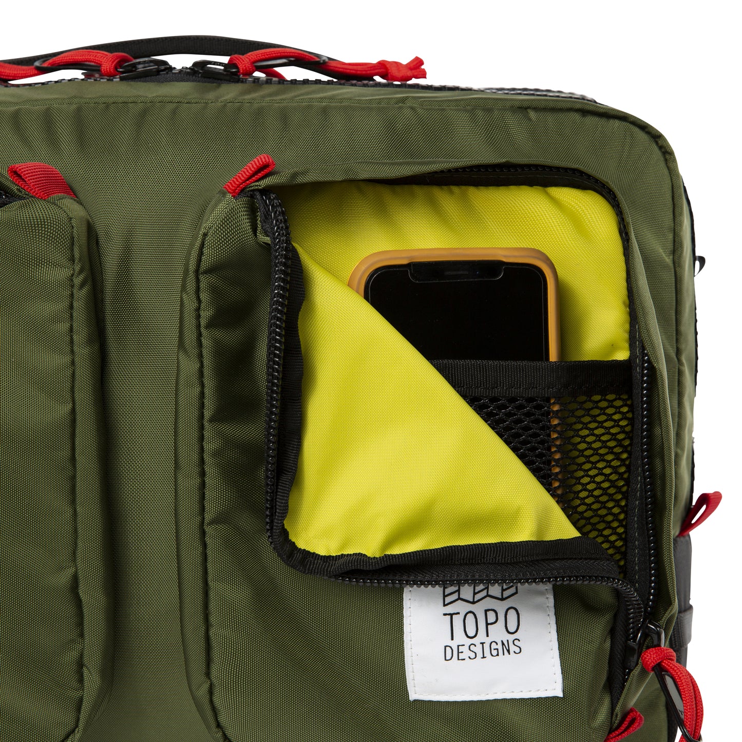 General close-up product shot of the global briefcase in olive showing use of the front zip pocket.
