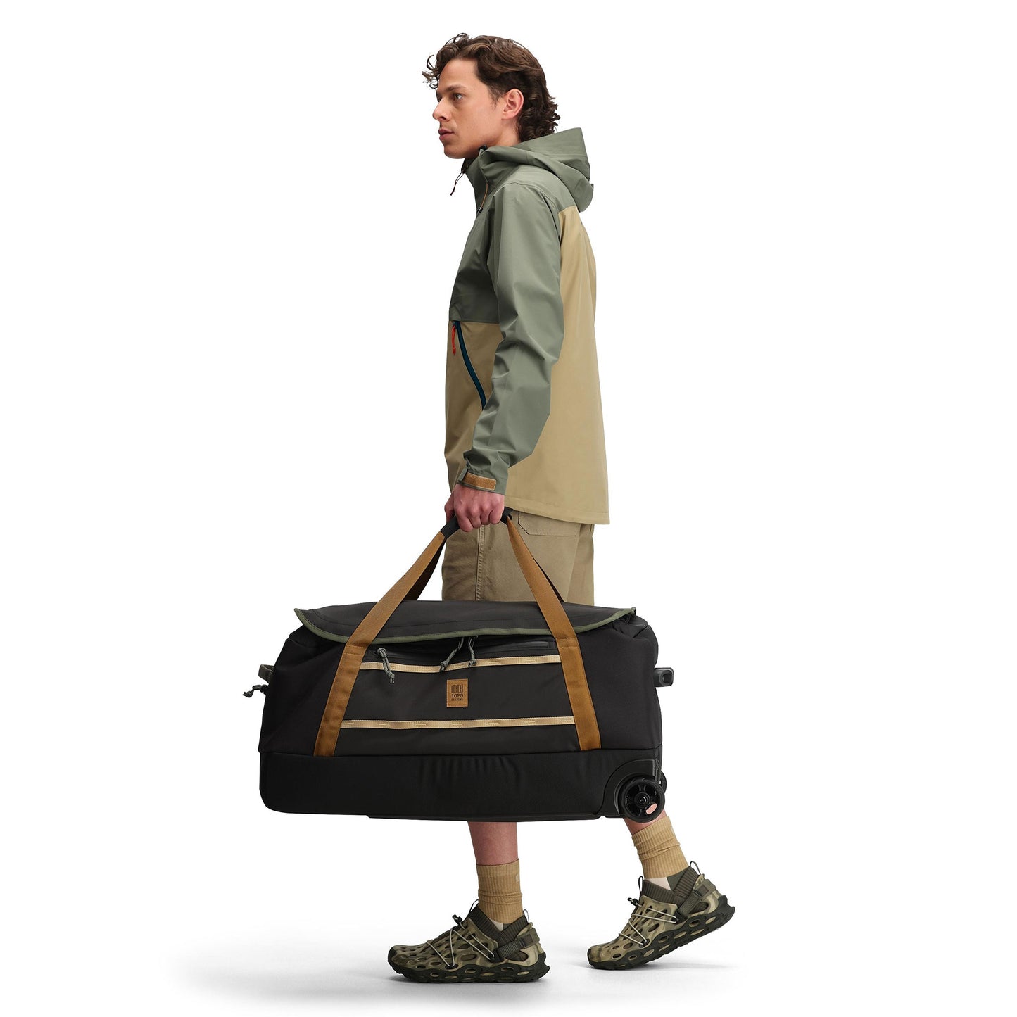Side model shot of Topo Designs Global Jacket - Men's in "Beetle / Elmwood"